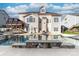 Large inground pool with stone coping and surrounding patio at 1009 Murandy Ln, Matthews, NC 28104