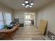 Dining room with new flooring, open to living room at 110 Courtland St, Chester, SC 29706