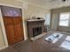 Living room with hardwood floors and brick fireplace at 110 Courtland St, Chester, SC 29706