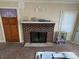 Living room with brick fireplace and hardwood floors at 110 Courtland St, Chester, SC 29706