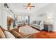 Living room with fireplace, hardwood floors, and seating at 1138 Millwright Ln, Matthews, NC 28104