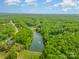 Aerial view of a lakefront community with lush green trees and a lake at 131 High Lake Dr, Statesville, NC 28677