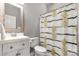 Clean bathroom with a shower/tub combo and white vanity at 138 Pinckney St, Chester, SC 29706