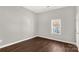 Bright bedroom with hardwood floors and a window at 138 Pinckney St, Chester, SC 29706