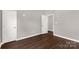 Simple bedroom with hardwood floors and access to another room at 138 Pinckney St, Chester, SC 29706