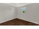 Well-lit bedroom featuring hardwood floors and a window at 138 Pinckney St, Chester, SC 29706