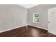 Bright bedroom with hardwood floors and a window at 138 Pinckney St, Chester, SC 29706