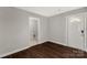 Bright entryway with dark hardwood floors and laundry access at 138 Pinckney St, Chester, SC 29706
