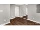 Clean hallway with hardwood floors and mirrored wall at 138 Pinckney St, Chester, SC 29706