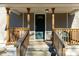 Front porch with wooden railings and steps at 138 Pinckney St, Chester, SC 29706