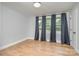 Well-lit bedroom with hardwood floors and large windows at 1512 Herrin Ave, Charlotte, NC 28205