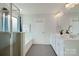 Modern bathroom with double vanity and soaking tub at 17344 Belmont Stakes Ln, Charlotte, NC 28278