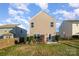 Charming home with a fenced backyard, patio, and landscaping at 195 Hidden Lakes Rd, Statesville, NC 28677