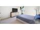 Guest bedroom with a blue comforter and modern dresser at 195 Hidden Lakes Rd, Statesville, NC 28677