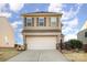 Two-story house with a neutral color scheme and a two-car garage at 195 Hidden Lakes Rd, Statesville, NC 28677