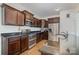 Modern kitchen with dark wood cabinets and granite countertops at 195 Hidden Lakes Rd, Statesville, NC 28677