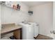 Laundry room with washer, dryer, and shelving for storage at 195 Hidden Lakes Rd, Statesville, NC 28677