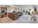 Open living space with a sectional sofa and built-in workspace at 195 Hidden Lakes Rd, Statesville, NC 28677
