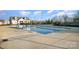 Community swimming pool with adjacent clubhouse at 195 Hidden Lakes Rd, Statesville, NC 28677