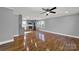 Open concept living room with hardwood floors and kitchen view at 206 Hunter St, York, SC 29745
