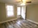 Bedroom with exterior door access and laminate flooring at 241 Henning Dr, Albemarle, NC 28001