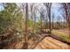 Wooded backyard with a partially cleared area at 277 Stewart Nw St, Concord, NC 28027