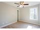 Bright bedroom with carpeted floor, ceiling fan and window at 277 Stewart Nw St, Concord, NC 28027