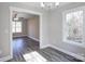 Open concept dining area with hardwood floors and view into living room at 277 Stewart Nw St, Concord, NC 28027
