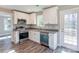 Well-equipped kitchen featuring stainless steel appliances and white cabinetry at 277 Stewart Nw St, Concord, NC 28027