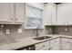 Kitchen with white cabinets, granite countertops, and stainless steel sink at 2978 Arthur Rd, Indian Land, SC 29707