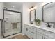 Bathroom with double vanity, shower, and modern fixtures at 3024 Sadler Woods Ln, Charlotte, NC 28214