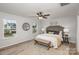 Spacious bedroom with a king-size bed and wood floors at 3024 Sadler Woods Ln, Charlotte, NC 28214