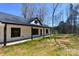 The exterior of a home featuring black trim, a covered porch and a well-maintained lawn at 3720 Turner Rd, Clover, SC 29710