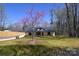 The exterior of a home featuring black trim, covered porch, lawn and flowering tree at 3720 Turner Rd, Clover, SC 29710