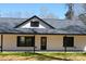 Close up exterior of a house featuring black trim, covered porch, and a well-maintained lawn at 3720 Turner Rd, Clover, SC 29710