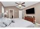 Main bedroom with king bed, TV, and access to bath at 487 Majestic Se Ct, Concord, NC 28025