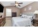 Spacious bedroom with king-size bed and ceiling fan at 487 Majestic Se Ct, Concord, NC 28025