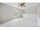 Well-lit bedroom with neutral walls and carpet at 6078 Bobcat Pl, Charlotte, NC 28269
