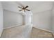 Bedroom with neutral walls and carpet, featuring a ceiling fan at 6078 Bobcat Pl, Charlotte, NC 28269