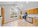Kitchen features wood cabinets and stainless steel appliances at 6078 Bobcat Pl, Charlotte, NC 28269