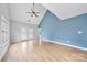 Bright living room with vaulted ceilings, hardwood floors, and access to patio at 6078 Bobcat Pl, Charlotte, NC 28269