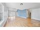 Open living room with vaulted ceilings and hardwood floors at 6078 Bobcat Pl, Charlotte, NC 28269