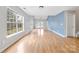 Spacious living area featuring hardwood floors and ample natural light at 6078 Bobcat Pl, Charlotte, NC 28269