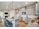 Modern kitchen with gray cabinets, granite countertops, and island at 6413 Mallow Crossing Ln, Charlotte, NC 28213