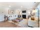 Light-filled living room featuring a cozy fireplace at 9835 Quercus Ln, Huntersville, NC 28078