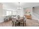 Bright dining room with hardwood floors and a stylish chandelier at 1066 Riverwalk Pkwy, Rock Hill, SC 29730