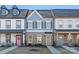 Two-story townhouses with light-colored siding and brick exteriors at 1066 Riverwalk Pkwy, Rock Hill, SC 29730