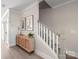 Light-toned stairwell with white railings and a stylish console table at 1066 Riverwalk Pkwy, Rock Hill, SC 29730