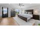 Main bedroom with lake view, wood flooring and a dresser at 111 Breezeview Pl, Mooresville, NC 28117