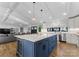 Modern kitchen with a large island, white cabinets, and stainless steel appliances at 111 Breezeview Pl, Mooresville, NC 28117